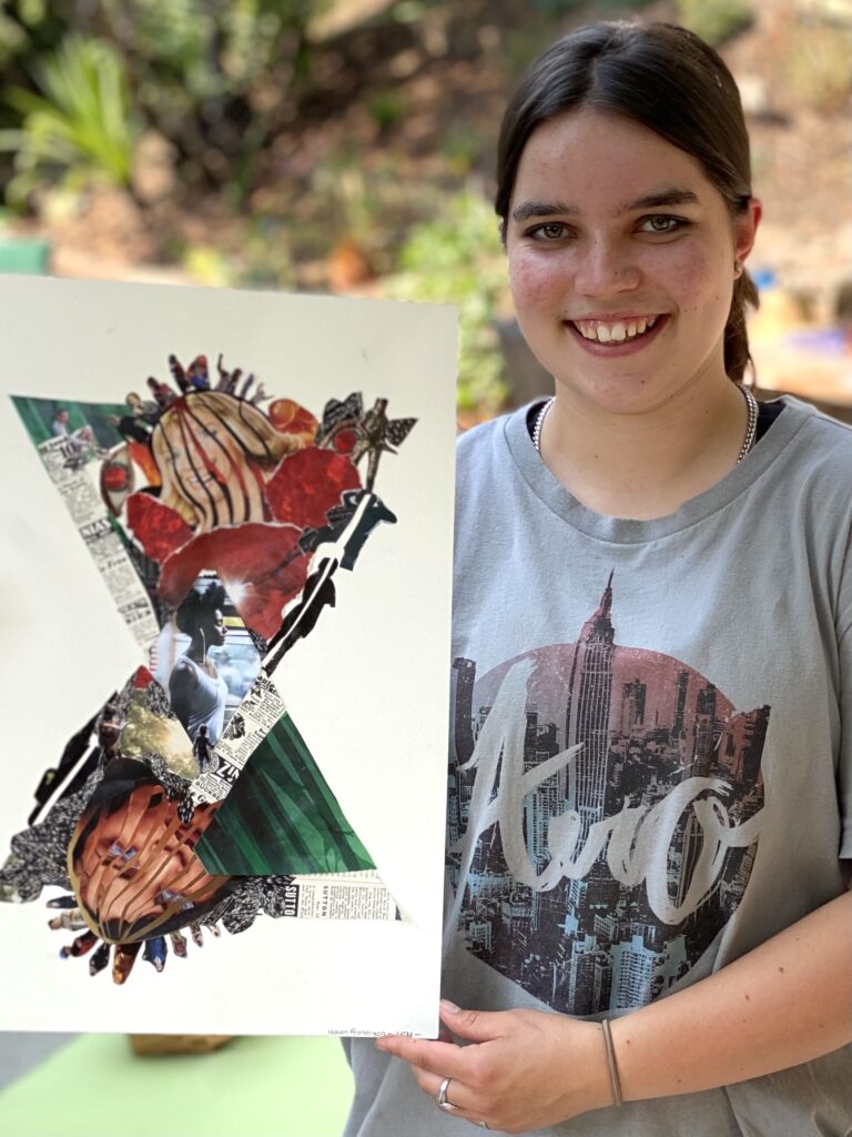 Teen student with her completed artwork created during a collage workshop.